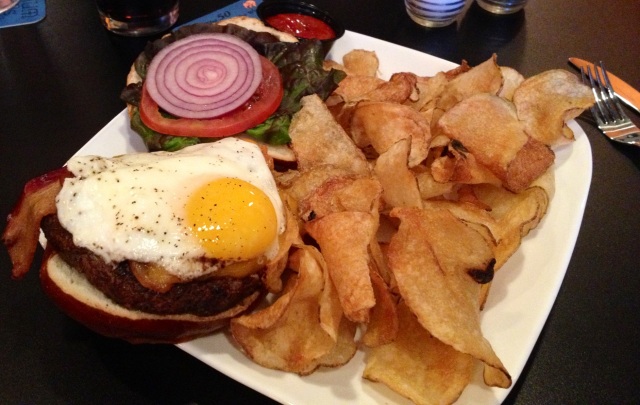 The Famous Kuma Burger: Medium-rare patty, bacon, and fried egg.